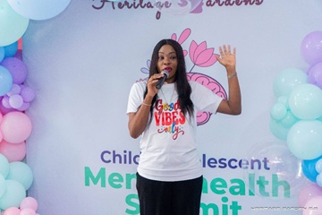 Young person speaking at a Heritage Gardens event
