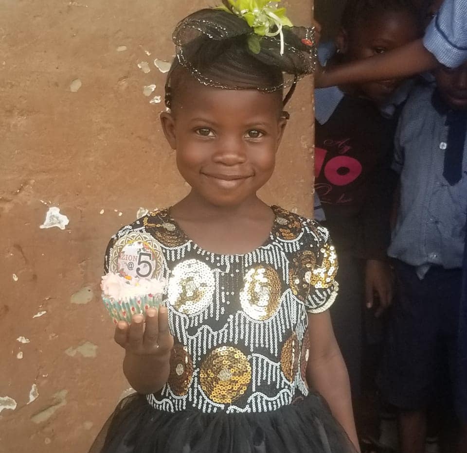 Child smiling at birthday celebration